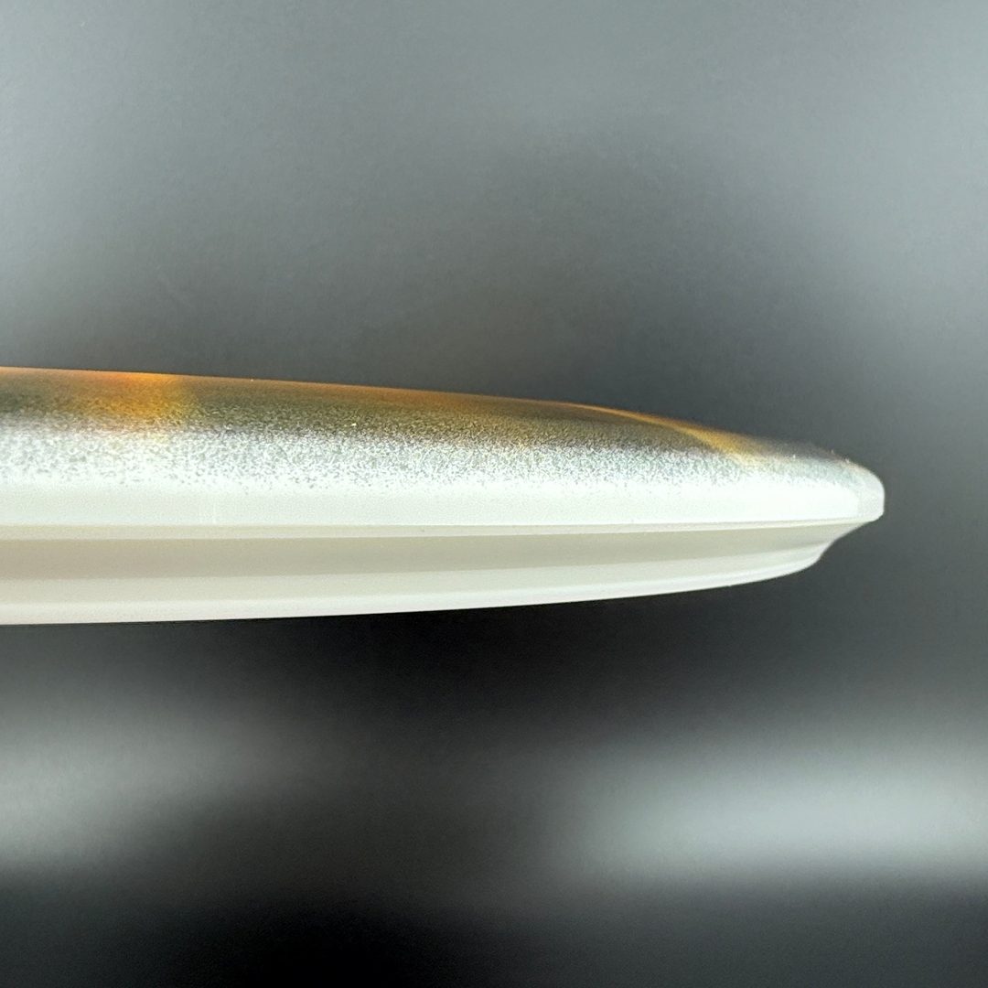 Gold Fuse disc golf disc by Rare Air Discs, STRATUS FEAR V3 model designed by Les White & Dan Kemp, with a shiny gold finish.