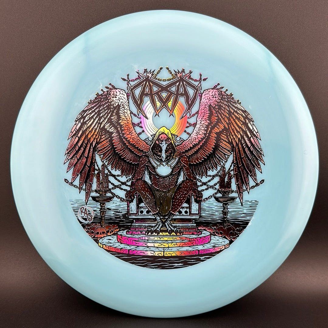 Rare Air Discs ESP Glo Buzzz disc golf disc in blue with copper clouds design, featuring Karudi the Overseer from Cult of RAD.